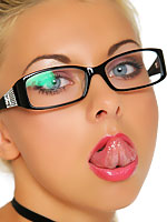 Lea Tyron posing her tight curves on a red couch