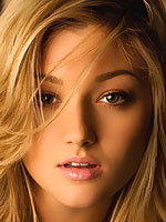 Katie Vernola sexy playmate stripping on the bed